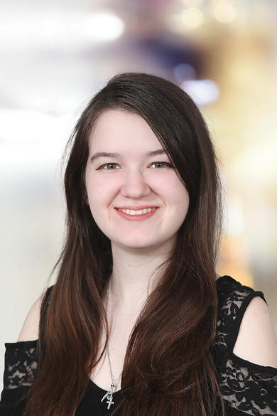 Portrait of Jess Mosholder, Creative Design Coordinator.